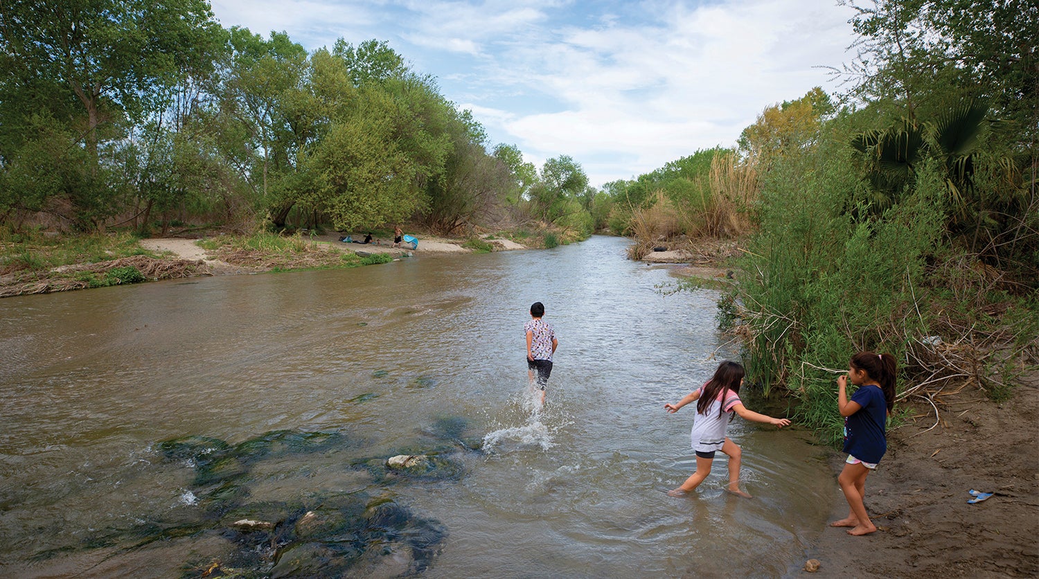 Children play on the Santa Ana River